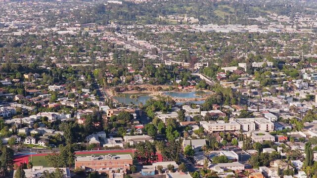 Residential Los Angeles suburb with sprawling houses and green spaces showing Rowena Reservoir in Los Feliz and Silver Lake neighborhoods