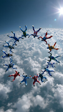 Group of faceless skydivers in freefall forming a circle formation above the clouds, colorful jumpsuits visible against bright sky, defocused cloud layer below, formation