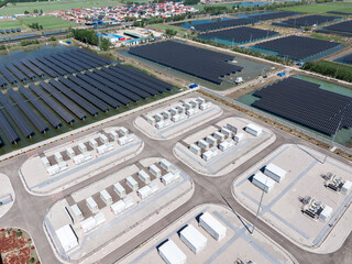 Aerial view of a photovoltaic power station and energy storage facilities with extensive solar panel arrays © zhu difeng
