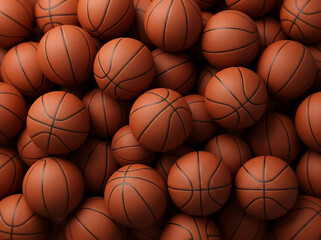 Obraz premium Many basketballs piled together on a court showing their surface details and texture during a practice session in a gym