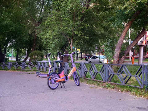 This purple electric bike with orange accents belongs to the MTS Yurent bike-sharing service: Abakan, Russia - June 10, 2026