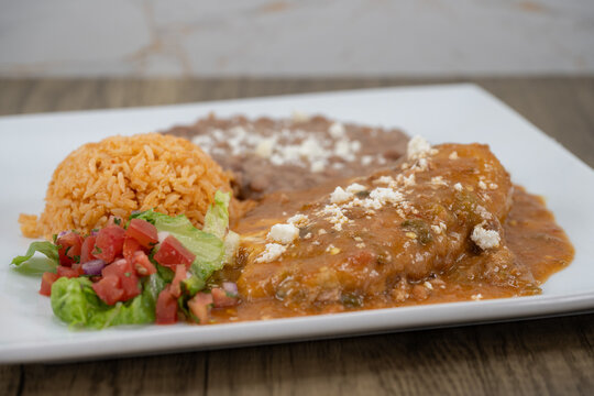 Breakfast chili poblano complete with rice and beans with pico de gallo