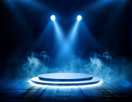 blue stage lights illuminating round platform with smoke effect