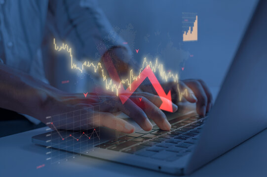 Downward Trend of Gold Stock Market Graph on Laptop