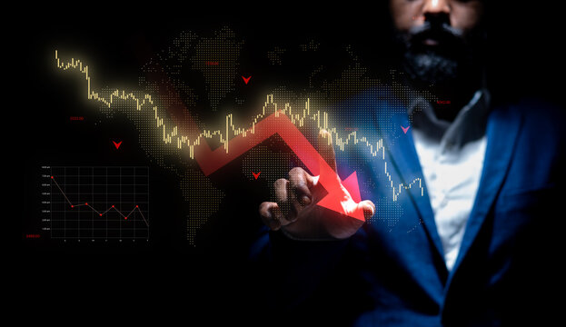 Man interacting with downward stock market graph