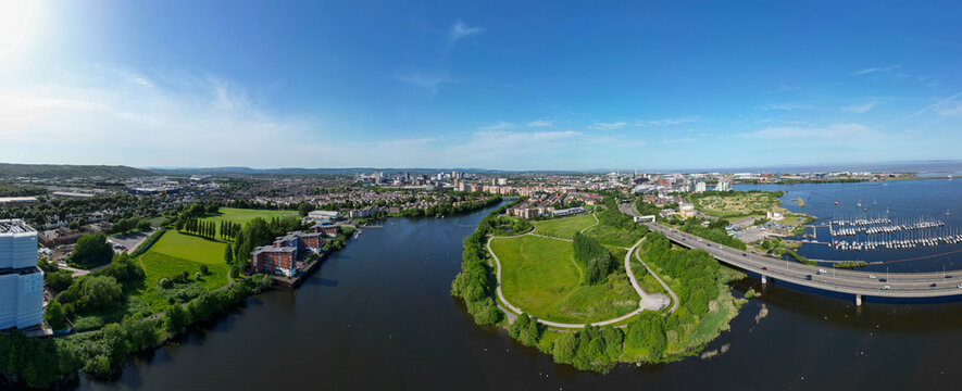 180&deg; Aerial Drone Panorama Over Cardiff Bay, River Ely, Hamadryad Park, Cardiff Bay Wetlands Reserve, Cardiff Bay Link Road, and the City Skyline on a Clear Summer Day, Wales, United Kingdom - 1/2