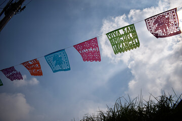 Naklejka premium Colorful Papel Picado Banners Celebrating San Miguel Xicalco Tradition in Mexico