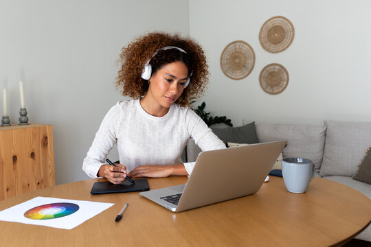 Woman working from home as digital graphic designer