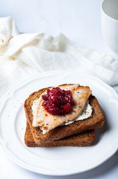 Open Sandwich with leftover turkey slices with cranberry sauce on top. Perfect holiday breakfast or lunch