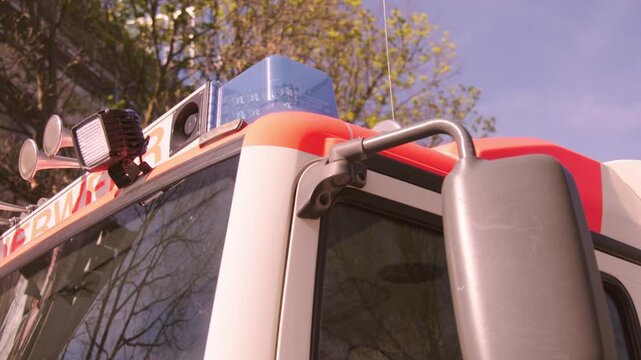 German department emergency municipal Fire truck, engine cab with blue lights on in city on street, urban rescue service, public safety Europe, , Feuerwehr vehicles, accidents and fires in Frankfurt
