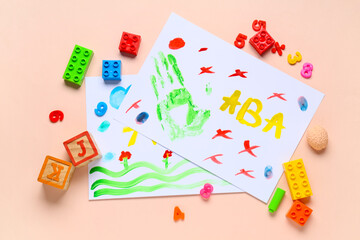 Naklejka premium Children's creative art activity with handprint and colorful drawings, educational playtime for early childhood development