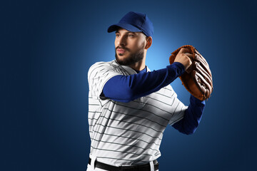 Naklejka premium Professional baseball player in striped uniform and blue cap with glove ready to catch ball on dark background, the athlete demonstrates focus and readiness for competition