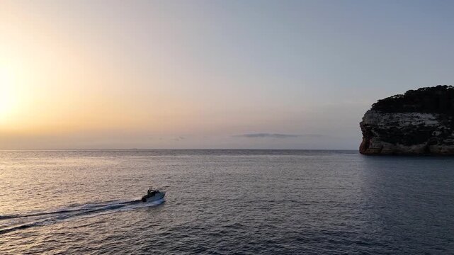 Javea sunset golden hour islet rock seascape Mediterranean aerial 4K