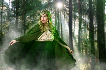 Fototapeta premium Beautiful elf girl in enchanted forest. Mysterious fairy
