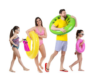 Obraz premium Family with beach stuff walking on white background