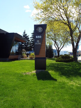 Gatineau, Quebec, Canada &ndash; May 10, 2026: A modern, vertical monument sign for "CPL Med Technologie" at 650 Bd de la Gappe stands on a grassy lawn.