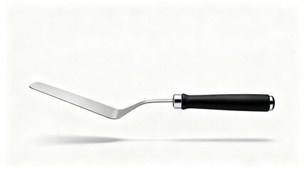 Fototapeta premium A stainless steel spatula featuring flat rectangular blade and smooth black ergonomic handle design.