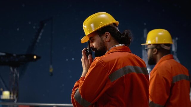 Speaking in walkie talkie, oil crisis and offshore rig engineer delivering reports over secure network while maintaining radio contact, blockade and drilling ship worker, for energy operations.