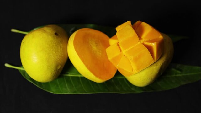 premium delicious Alphonso mango juicy pulp sliced and fresh whole fruits