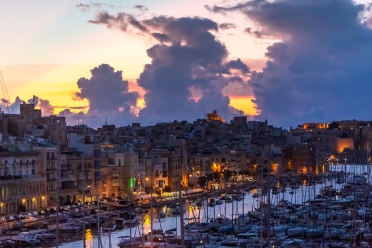 Malta, boats in port of Valletta, Island of Malta in sunset.