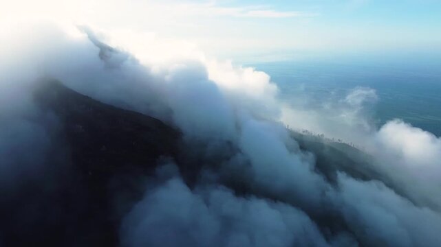 Aerial view of ijen volcano mountain peak covered by clouds