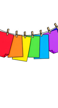 Rainbow Color Paper Sheets Hang Drying On A Line
