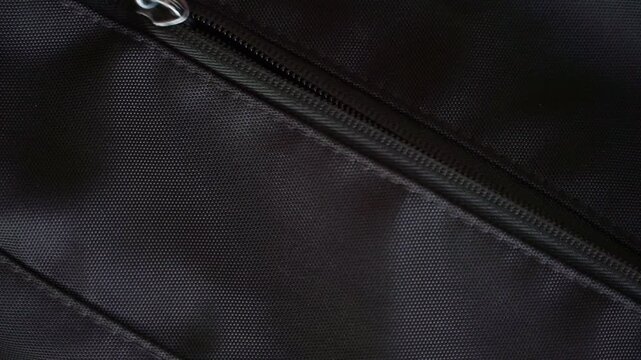 Person opening a backpack zipper and revealing a smartphone with call notification from "My Wife" and take them. Modern gadget, mobile technology, and lifestyle video footage.