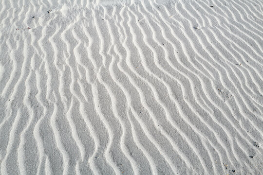 The pure white sands of a winter beach in St. Augustine Florida with beautiful patterns in the sand
