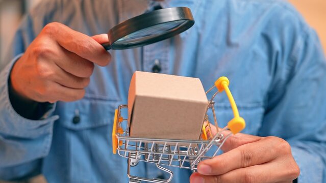 The act of inspecting an e-commerce product represents the need for transparency, informed decision-making, consumer rights, and the rising demand for quality control in the digital shopping era.

