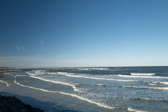 The rough waves and waters of the atlantic ocean meeting the inlet and ouotlet of the Matanzas River near St. Augustine Florida