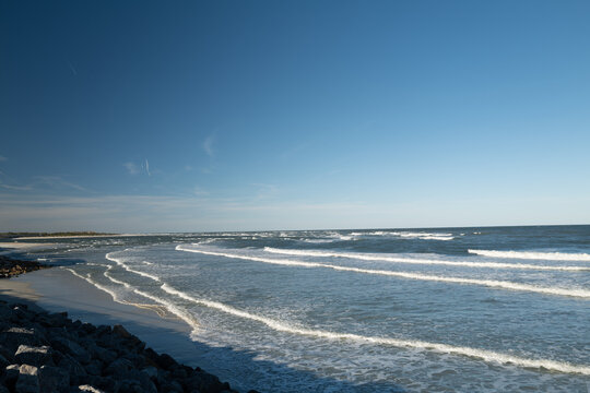 The rough waves and waters of the atlantic ocean meeting the inlet and ouotlet of the Matanzas River near St. Augustine Florida