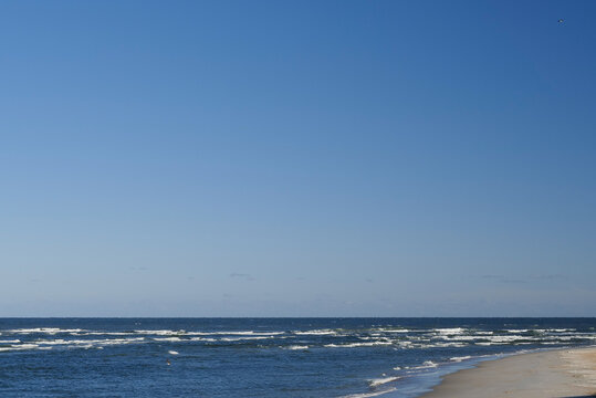The rough waves and waters of the atlantic ocean meeting the inlet and ouotlet of the Matanzas River near St. Augustine Florida