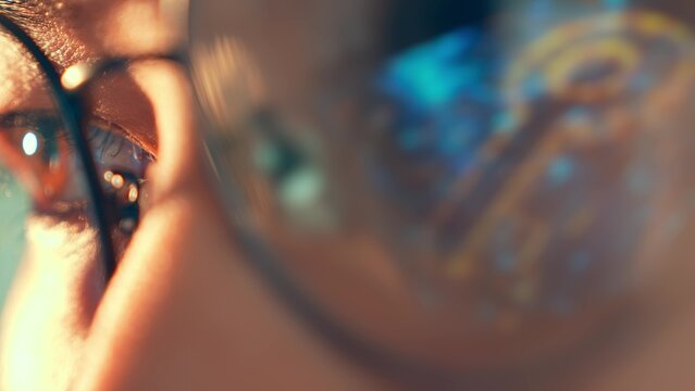 A close-up of a person&rsquo;s eye in glasses reflecting a digital key icon represents data security, privacy awareness, identity protection and the importance of digital access control in the modern world.