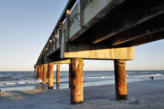 The wooden pier on St. Augustine Beach in Florida at Sunset