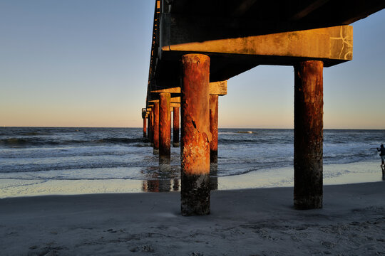 The wooden pier on St. Augustine Beach in Florida at Sunset