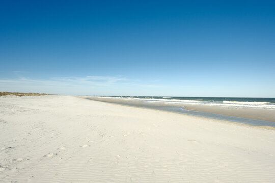 A wide expanse of white sand beach on a winter afternoon in St. Augustine Florida