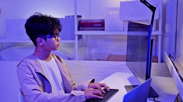 Focused Male Software Developer Write Program Code On Desktop Computer