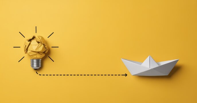 Creative concept of idea to execution with paper lightbulb and paper boat on yellow background
