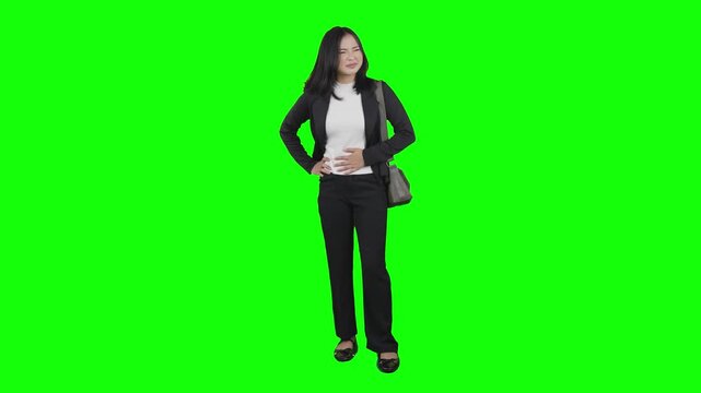 Asian Businesswoman Suffering from Severe Stomach Ache on Green Screen