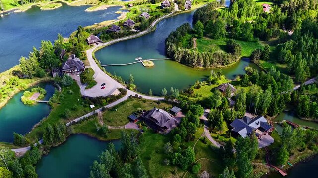 Charming lakeside community surrounded by lush greenery and interconnected waterways. Ideal for real estate promotions or travel content. Captures the essence of tranquil living.