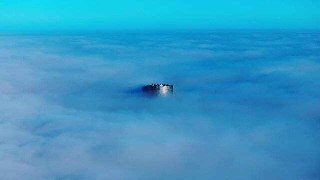 Zunda Towers emerge through dense fog above Riga as endless cloud