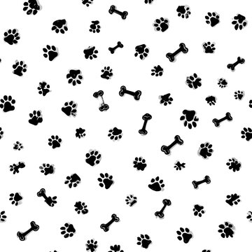 Seamless pattern with black dog paw prints and bones on a white background, featuring a grunge texture