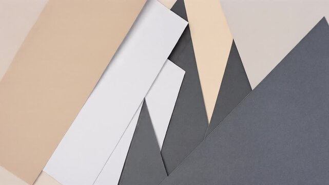 Neutral Geometric Paper Shapes Overlapping and Forming an Abstract Pattern