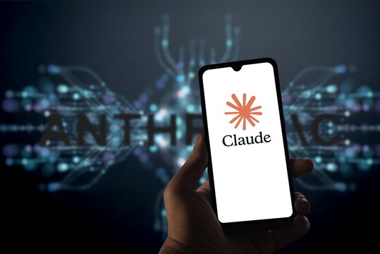 Anthropic Claude AI Logo Displayed on Smartphone Screen in Front of Abstract Tech Background.