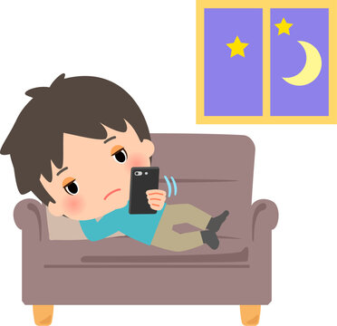 スマホをいじって夜更かしする若い男性