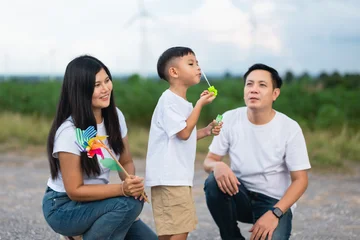 Family of three shares a joyful moment outdoors © lovelyday12