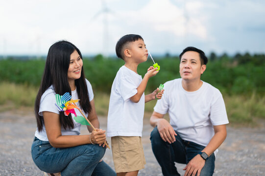 Family of three shares a joyful moment outdoors