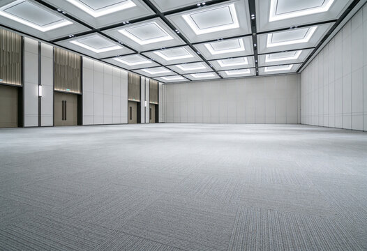 Empty modern ballroom interior with elegant ceiling lighting and spacious carpet floor for corporate events. ballroom, empty, interior, modern, hall, room, ceiling, lighting, carpet, luxury.