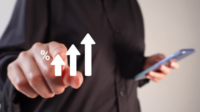 A businesswoman holding a smartphone points forward at a graphic animation featuring rising arrows surrounded by percentage symbols. Ideal for charts, reports, or financial visual representations.