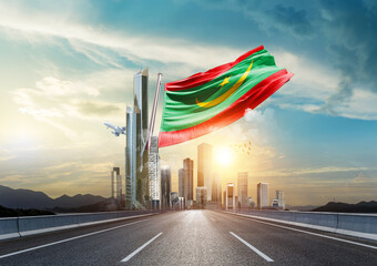 Mauritania flag waving with modern and developed landscape. Mauritania national flag for independence day.